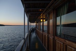 Sunset_on_Vättern_lake,_Sweden_-_photo_picture_image_photography_boat_water_reflection_water_(9586348944)
